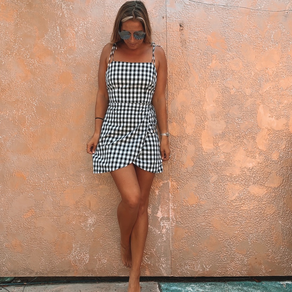 Block and white checkered mini wrap dress